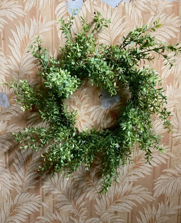 Realistic artificial boxwood wreath in a spiral shape