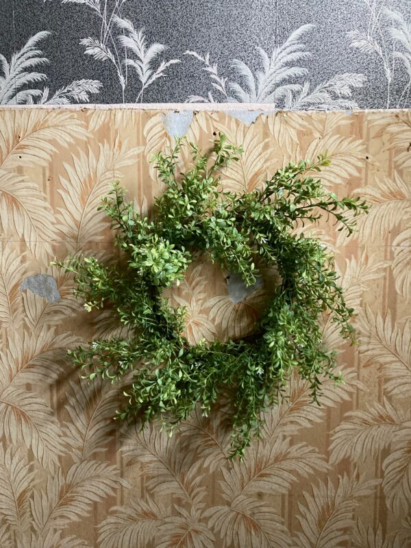 Realistic artificial boxwood wreath in a spiral shape