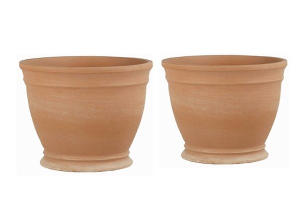 Two medium-sized terracotta planters with a soft patina and a footed base.