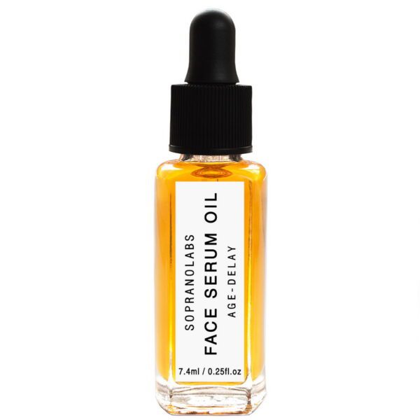 A small glass bottle of face serum oil is displayed. The bottle has a rectangular shape with a clear body that reveals the amber-colored oil inside. It features a black dropper cap and a white label that reads "SOPRANOLABS FACE SERUM OIL AGE-DELAY" along with the volume of 7.4ml (0.25fl. oz). The overall design is sleek and modern, emphasizing the product's skincare purpose.