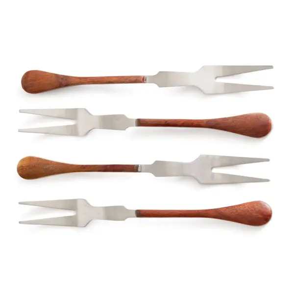 Four meat forks are arranged in a row. Each fork features a stainless steel pronged head and a wooden handle. The handles vary slightly in shape, with some having a rounded end and others being more elongated. The forks are positioned with the prongs facing upwards, showcasing their shiny metal finish against a plain white background.