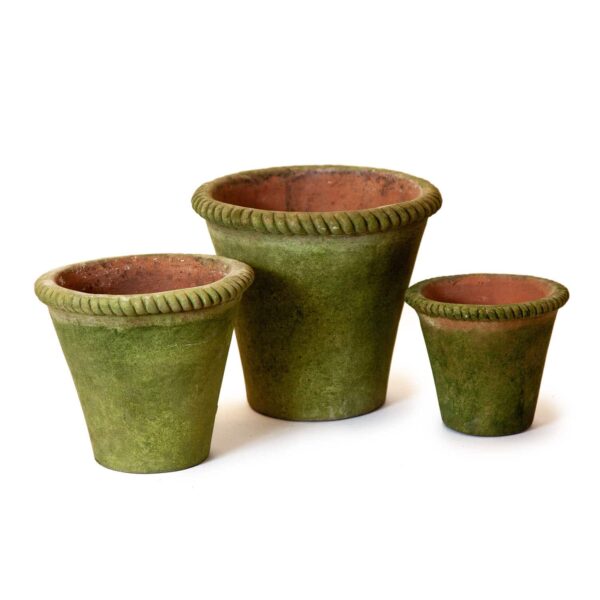Three terracotta pots in varying sizes are displayed. Each pot has a green exterior with a textured finish and a decorative twisted rim. The interiors are a warm terracotta color, contrasting with the green outside. The pots are arranged from largest to smallest, showcasing their different dimensions.