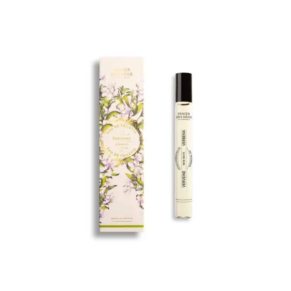 A cylindrical glass bottle of eau de toilette is displayed next to its decorative box. The bottle features a black cap and is labeled "VERBENA" with additional text indicating it's a fragrance. The box is adorned with a floral design, predominantly featuring green and white colors, and includes the brand name "PANIER DES SENS" along with the phrase "MADE IN FRANCE." The overall aesthetic is elegant and fresh, reflecting the essence of the verbena scent.
