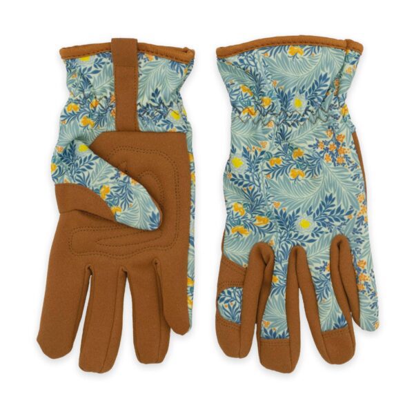 A pair of gardening gloves is displayed, featuring a floral pattern in shades of blue, yellow, and orange on the back. The palms and fingers are made of a brown material, providing a sturdy grip. The gloves have a gathered wrist design for a snug fit.