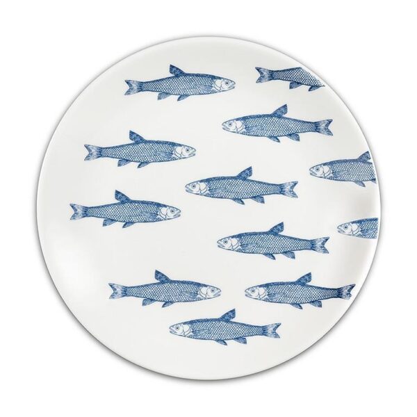 A round white plate features a pattern of blue fish illustrations. The fish are depicted in a stylized manner, swimming in various directions across the surface of the plate. The overall design is simple yet visually striking, with a clean and nautical aesthetic.