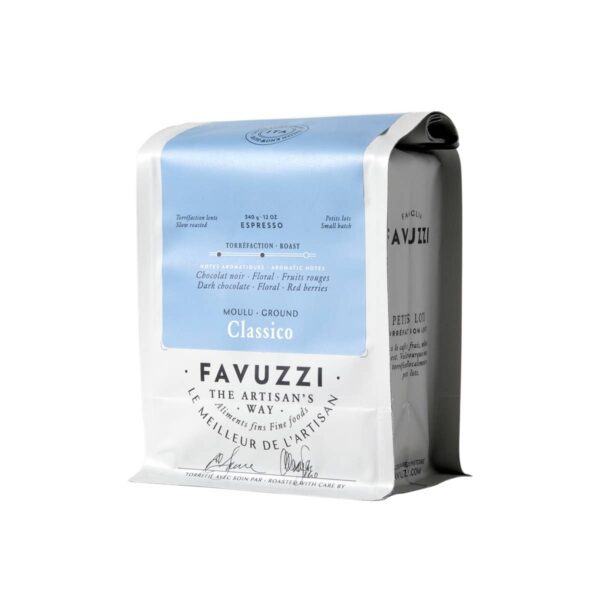 A bag of ground coffee labeled "Classico" from Favuzzi. The packaging features a predominantly white design with a light blue top section. It indicates that the coffee is an espresso roast, weighing 340 grams (12 oz). Descriptive notes highlight flavors such as dark chocolate, floral, and red berries. The bag also includes the phrase "The Artisan's Way" and mentions that it is slow roasted.