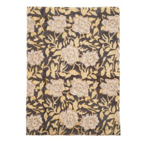A patterned fabric featuring a dark background adorned with large, light-colored flowers and intricate yellow leaves. The floral design is bold and detailed, creating a vibrant contrast against the darker base. The overall aesthetic is elegant and decorative, suitable for various textile applications.