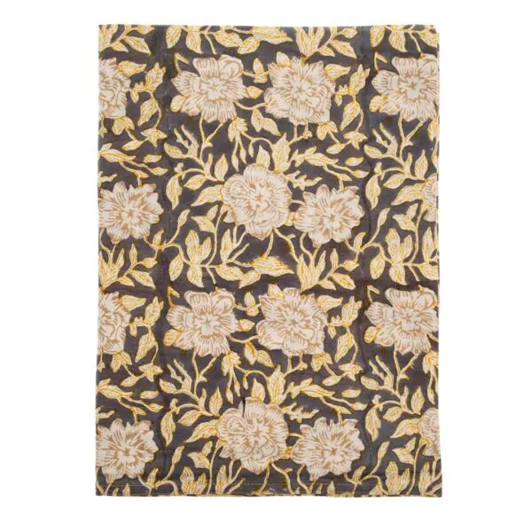 A patterned fabric featuring a dark background adorned with large, light-colored flowers and intricate yellow leaves. The floral design is bold and detailed, creating a vibrant contrast against the darker base. The overall aesthetic is elegant and decorative, suitable for various textile applications.