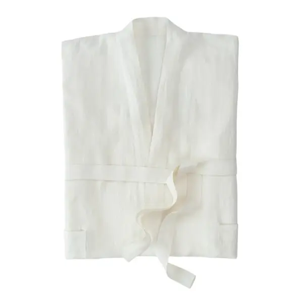 A folded white robe made of a lightweight fabric is displayed. It features a shawl collar and a tie belt, with two side pockets visible on the front. The robe has a simple, elegant design, suitable for lounging or spa use.
