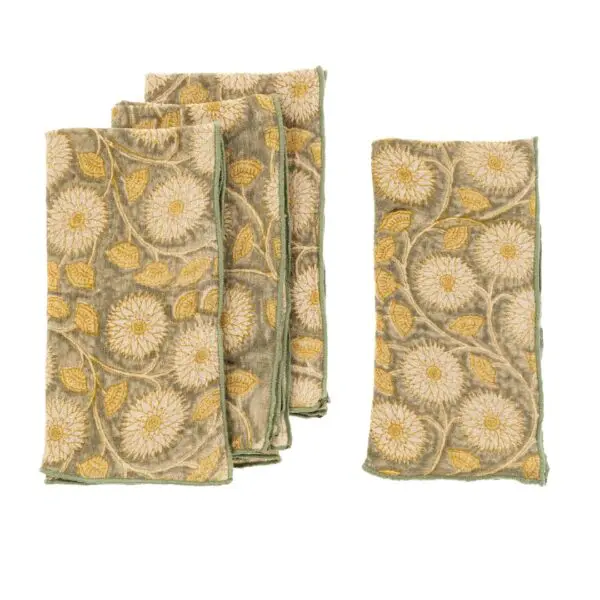 A set of five decorative napkins featuring intricate embroidery. The design includes large white flowers with yellow centers, surrounded by green leaves and vines. The napkins have a soft, muted green background and are bordered with a green trim. Four of the napkins are stacked together, while one is positioned separately.